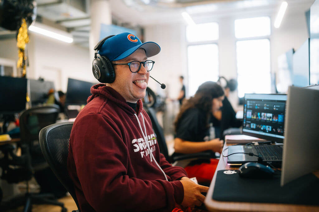 A community member working at a desk during a Profound hackathon