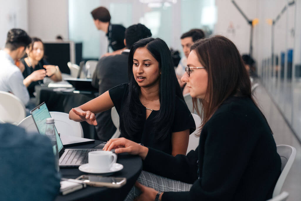 Two attendees working through a session together at a Profound workshop